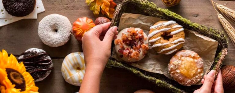 Person adjusting donut platter