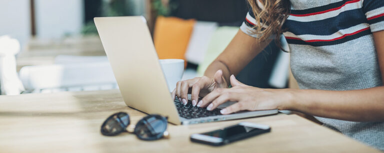 Woman typing on laptop
