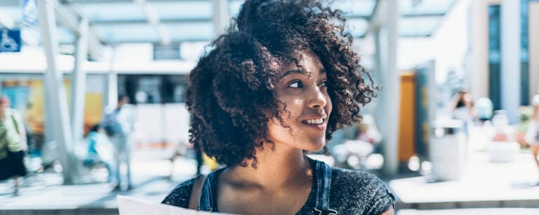 Woman smiling with city background