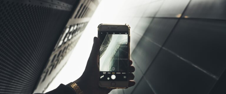 iPhone taking a photo of skyscrapers