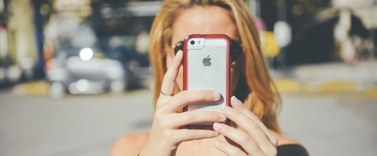 girl with phone in front of her face